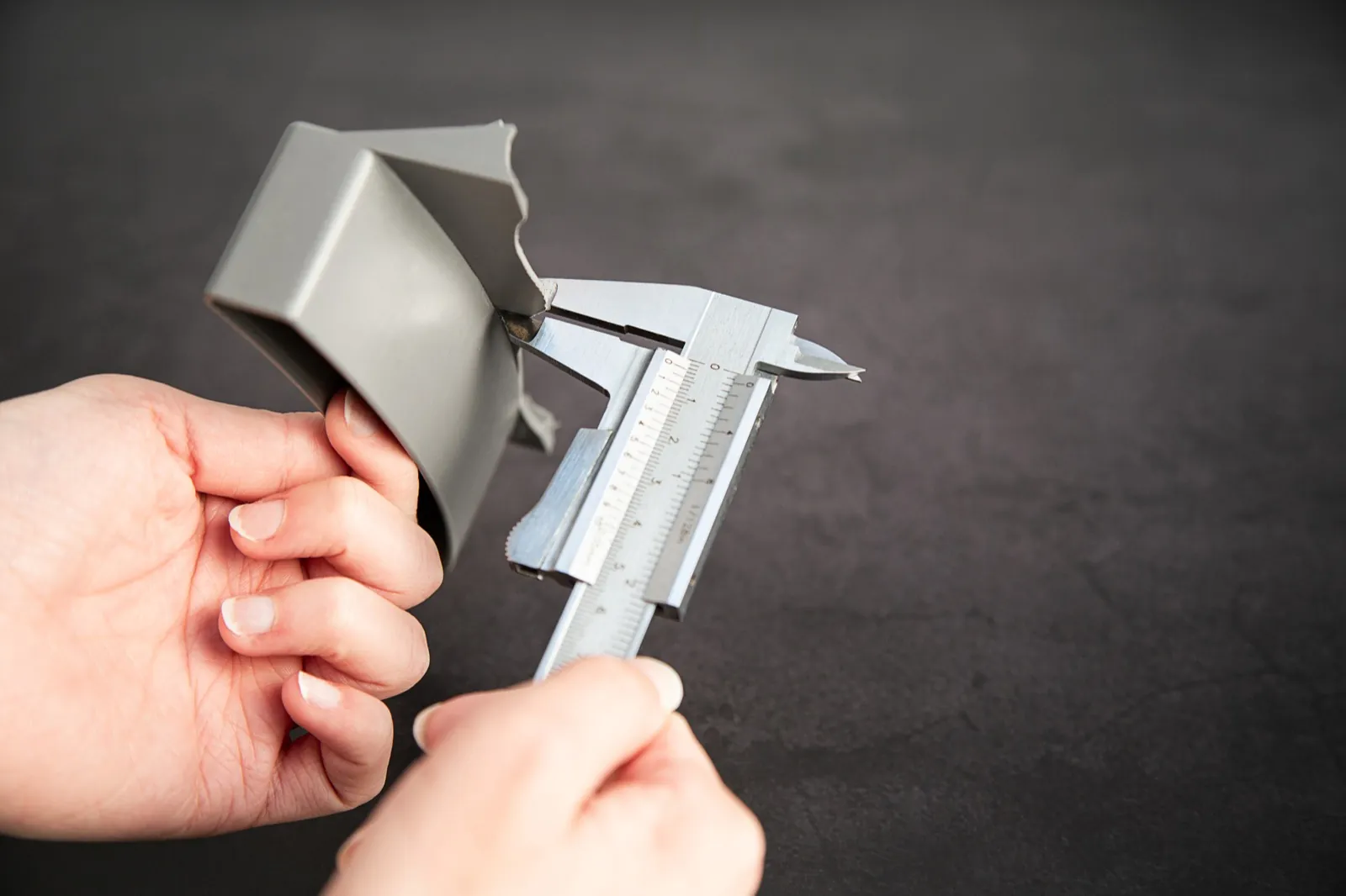Measuring the broken part with calipers